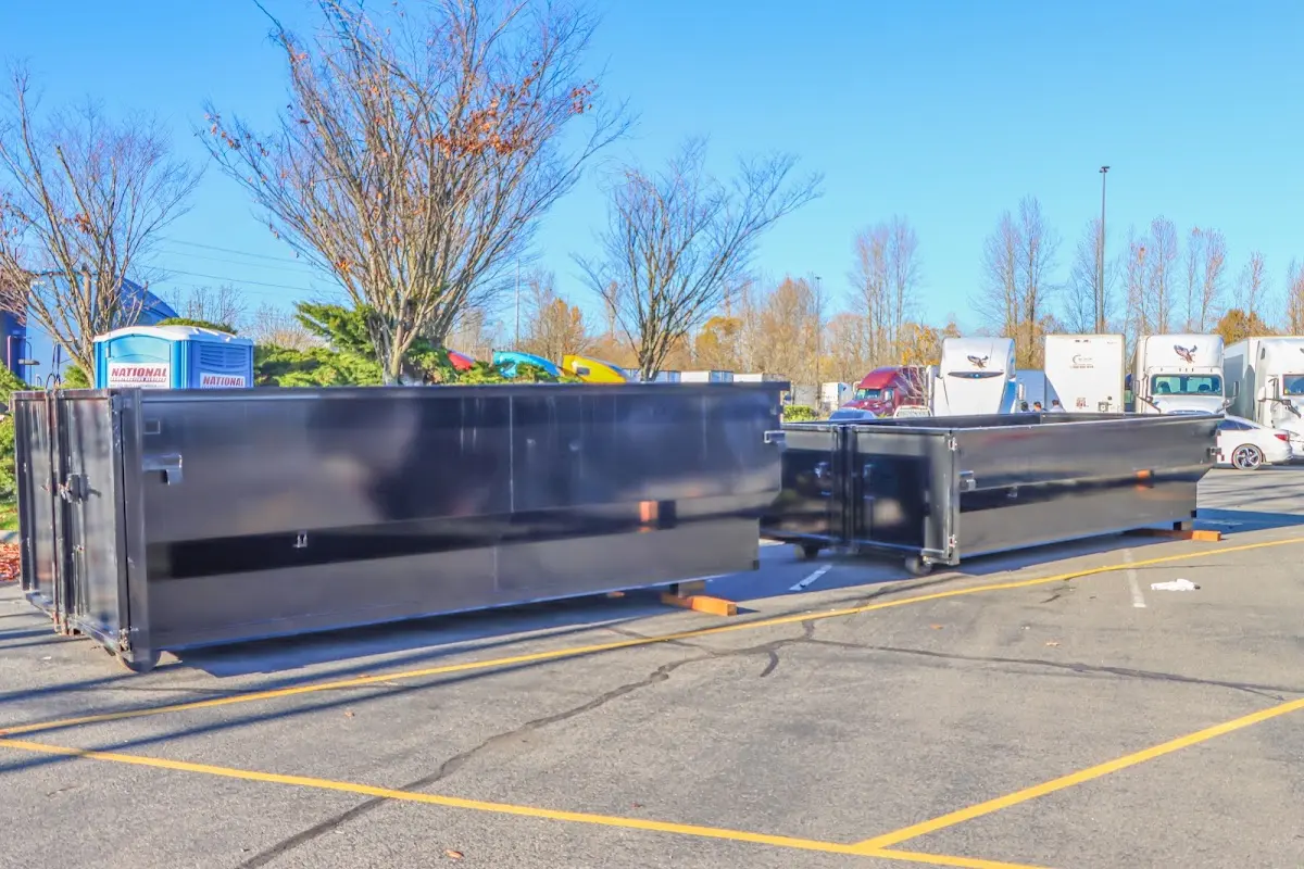 Professional dumpster rental service with roll-off container on residential driveway in Gulf Breeze